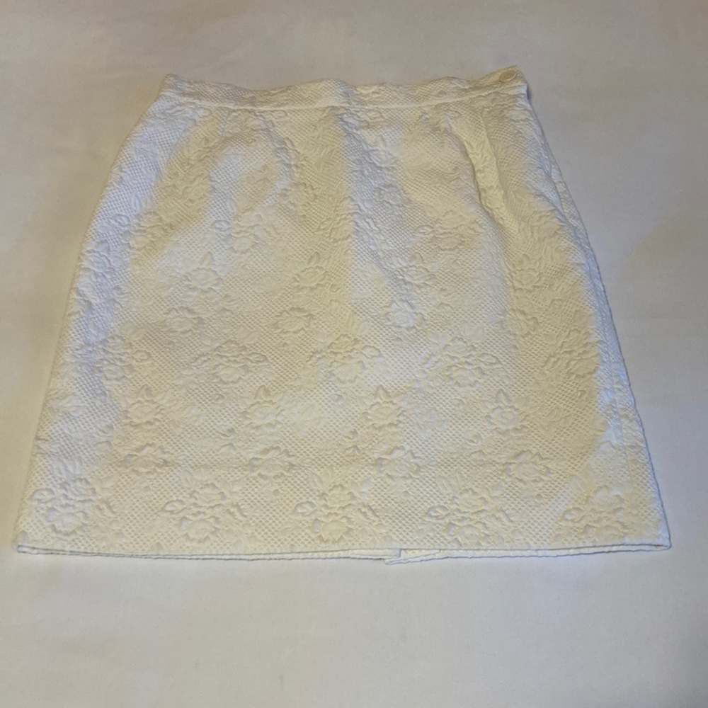 Yves Saint Laurent white skirt with stunning detail.